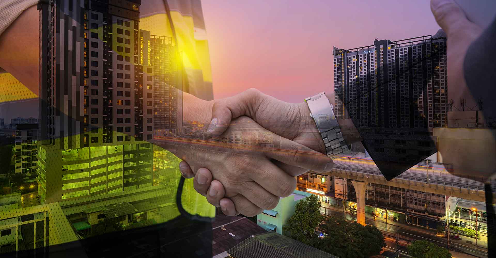 Architects and contractors shake hands to work. Sunset scence of modern office buildings and condominium. Future building construction with double exposure of engineer